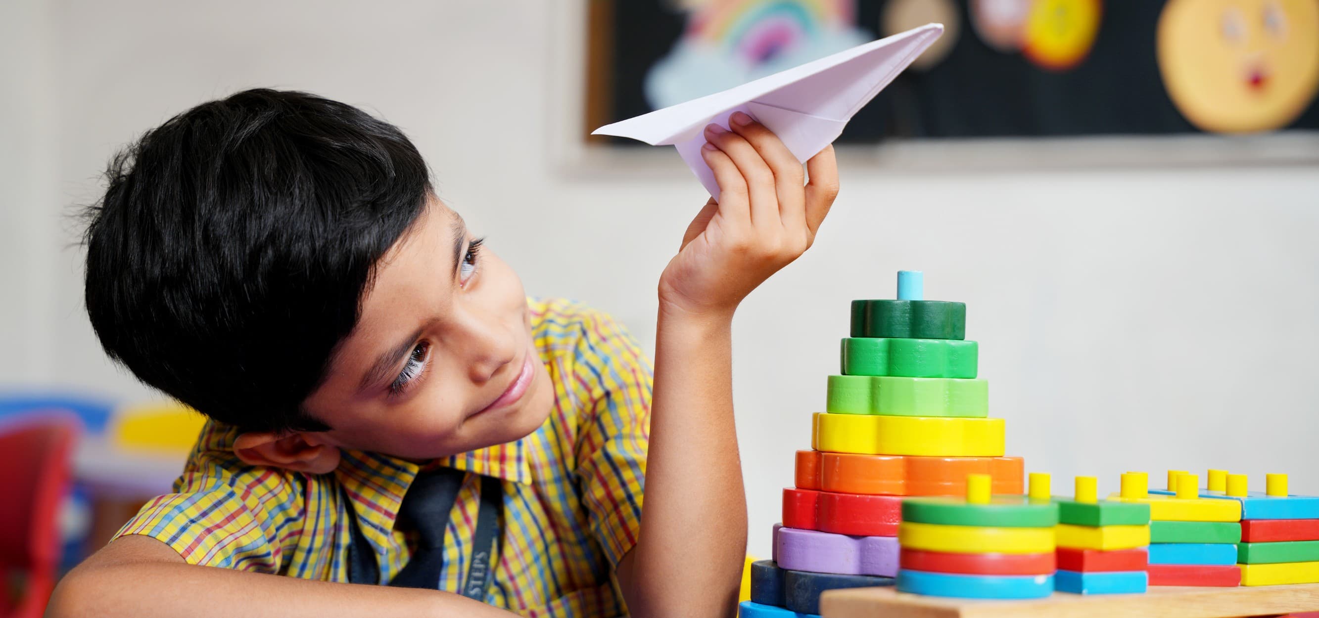 Child playing with toys and airplane